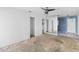 Empty living room, featuring natural light, ceiling fan and access to other rooms at 410 73Rd Ave, St Pete Beach, FL 33706
