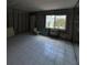 Bathroom featuring tiled floor, large window, and air conditioning unit in mid construction phase at 4129 Dolphin Dr # 103, Tampa, FL 33617