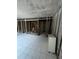 Bathroom under renovation featuring tiled floor, exposed framework, and plumbing fixtures at 4129 Dolphin Dr # 103, Tampa, FL 33617