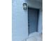 Inviting unit entrance, featuring neutral exterior door and textured stucco wall, offering a private welcome at 4129 Dolphin Dr # 103, Tampa, FL 33617