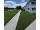 Well-maintained condominiums along the lake, showcasing lush green lawns and serene water views at 4148 Dolphin Dr # 3, Tampa, FL 33617