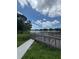 Picturesque dock featuring lake views and a sunny, blue sky with fluffy white clouds at 4148 Dolphin Dr # 3, Tampa, FL 33617