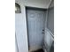 Close-up of a grey front door with unit number 412 and exterior light at 4148 Dolphin Dr # 3, Tampa, FL 33617