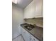 This kitchen includes plenty of counter space, storage and a stainless steel sink at 4148 Dolphin Dr # 3, Tampa, FL 33617