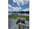 Scenic view of the lake featuring a gazebo and lush landscaping, from the stairs at 4148 Dolphin Dr # 3, Tampa, FL 33617