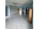 A spacious living room featuring tile flooring, ceiling fan and neutral paint at 4148 Dolphin Dr # 3, Tampa, FL 33617