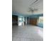 Spacious living room featuring tile floors, a ceiling fan, and access to other rooms at 4148 Dolphin Dr # 3, Tampa, FL 33617