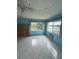 Bright living room featuring tile flooring, a ceiling fan and scenic lake views at 4148 Dolphin Dr # 3, Tampa, FL 33617