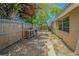 Backyard featuring mature trees, work bench, and partially shady area with potential for landscaping at 4150 Woodsville Dr, New Port Richey, FL 34652