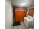 Bathroom featuring modern fixtures, a well-lit vanity, and an orange shower curtain at 4150 Woodsville Dr, New Port Richey, FL 34652
