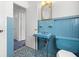 Colorful bathroom with blue tile, pedestal sink, and toilet at 417 66Th S Ave, St Petersburg, FL 33705