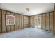 Bright bedroom with a neutral color scheme, natural light, and access to the outdoor space at 417 66Th S Ave, St Petersburg, FL 33705