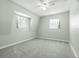 Bedroom with carpet, a ceiling fan and natural light from the windows at 417 66Th S Ave, St Petersburg, FL 33705