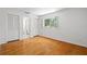 Bright bedroom featuring hardwood floors, natural light, and ample closet space at 417 66Th S Ave, St Petersburg, FL 33705
