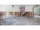 Open floor plan with exposed studs and a staircase, providing a glimpse of the home's layout at 417 66Th S Ave, St Petersburg, FL 33705