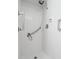 Bathroom shower featuring white tile and modern fixtures at 417 66Th S Ave, St Petersburg, FL 33705
