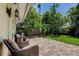 A private backyard brick patio nestled among lush tropical landscaping at 4174 14Th Ne Ln, St Petersburg, FL 33703