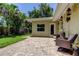 View of the backyard patio featuring an outdoor dining area perfect for entertaining at 4174 14Th Ne Ln, St Petersburg, FL 33703