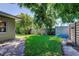 Well-manicured backyard with lush landscaping and a privacy fence at 4174 14Th Ne Ln, St Petersburg, FL 33703
