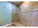Bathroom showcasing a glass-enclosed shower with tiled walls and modern fixtures at 4174 14Th Ne Ln, St Petersburg, FL 33703