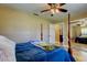 Bedroom featuring a four-poster bed, closet, and tile floors at 4174 14Th Ne Ln, St Petersburg, FL 33703