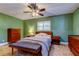 Bedroom features a double bed, tiled flooring, and a large window at 4174 14Th Ne Ln, St Petersburg, FL 33703