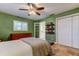 Bedroom features a double bed, tiled flooring, walk-in closet and ensuite bathroom at 4174 14Th Ne Ln, St Petersburg, FL 33703