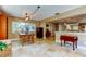 Dining room with tile floors, large windows, and a view of the kitchen at 4174 14Th Ne Ln, St Petersburg, FL 33703