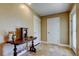 Well-lit entryway featuring travertine flooring and neutral-toned walls leading to various rooms at 4174 14Th Ne Ln, St Petersburg, FL 33703