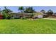 Charming single-Gathering home featuring well-kept landscaping and a sprawling green lawn at 4174 14Th Ne Ln, St Petersburg, FL 33703