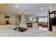 Modern kitchen featuring stainless steel sink, granite countertops, and views to living area at 4174 14Th Ne Ln, St Petersburg, FL 33703