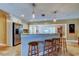 Open kitchen layout with breakfast bar, stainless steel appliances, and travertine floors at 4174 14Th Ne Ln, St Petersburg, FL 33703