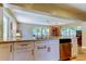 Kitchen featuring stainless steel dishwasher, white cabinets, and granite countertops at 4174 14Th Ne Ln, St Petersburg, FL 33703