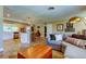 Open-concept space with tile floors, seamless living room and kitchen, with a view into a bedroom at 4174 14Th Ne Ln, St Petersburg, FL 33703