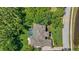 Aerial shot of a luxurious home with a pool, lush landscaping, and a well-manicured lawn at 4512 Cheval Blvd, Lutz, FL 33558