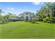 Beautiful two-story home featuring a well-manicured front yard and decorative shrubbery at 4512 Cheval Blvd, Lutz, FL 33558