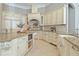Open kitchen with custom cabinets, granite countertops, stainless steel appliances and central island with sink at 4512 Cheval Blvd, Lutz, FL 33558
