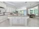 Spacious kitchen with custom cabinets, granite countertops, and stainless steel appliances with an island at 4512 Cheval Blvd, Lutz, FL 33558