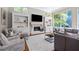 Spacious living room with fireplace and built-in shelving at 4512 Cheval Blvd, Lutz, FL 33558