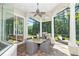 Entertain outdoors with ease with this amazing outdoor kitchen and dining area on the screened lanai at 4512 Cheval Blvd, Lutz, FL 33558