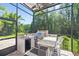 Cook outside on your granite countertop outdoor kitchen, equipped with grill and refrigerator at 4512 Cheval Blvd, Lutz, FL 33558