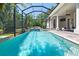 Sparkling pool with attached spa and screened enclosure offers outdoor enjoyment and privacy at 4512 Cheval Blvd, Lutz, FL 33558