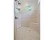Enjoy the spa-like shower with dual showerheads and tiled bench in primary bathroom at 4512 Cheval Blvd, Lutz, FL 33558