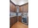 Wet bar featuring custom wood cabinets, granite countertops, and wine fridge at 4512 Cheval Blvd, Lutz, FL 33558