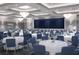 Elegant ballroom featuring rows of tables adorned with floral centerpieces beneath sophisticated chandeliers at 4888 Sevilla Shores Dr, Wimauma, FL 33598