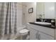 Bathroom with a shower/tub combo and a modern vanity with a granite countertop at 4888 Sevilla Shores Dr, Wimauma, FL 33598