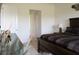 Comfortable bedroom with wood furniture and a neutral color palette, creating a relaxing atmosphere at 4888 Sevilla Shores Dr, Wimauma, FL 33598