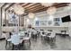 Cafe del Sol interior with contemporary decor, stylish seating, and decorative lighting fixtures at 4888 Sevilla Shores Dr, Wimauma, FL 33598