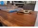 Close-up of a modern coffee table, showcasing its unique design and wood grain at 4888 Sevilla Shores Dr, Wimauma, FL 33598