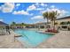 A sparkling community pool and poolside amenities offer residents a perfect spot to relax, swim, and socialize at 4888 Sevilla Shores Dr, Wimauma, FL 33598
